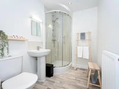 a bathroom with a shower and a sink and a toilet at Brand new 1 bedroom modern contemporary apartment - Pass the Keys in Ludlow