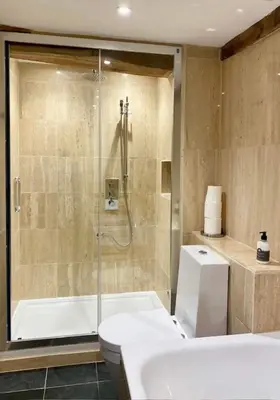 a bathroom with a shower and a toilet and a sink at Hay On Wye Welsh Townhouse in Hay centre in Hay-on-Wye