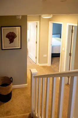 a hallway with a staircase leading to a bedroom at The Fanny Talbot in Barmouth