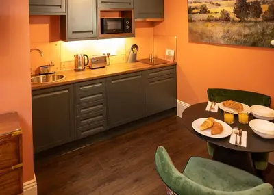 a kitchen with a table with food on it at The Fanny Talbot in Barmouth