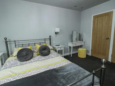 a bedroom with a bed with two pillows on it at Wesleyan House in Oswestry
