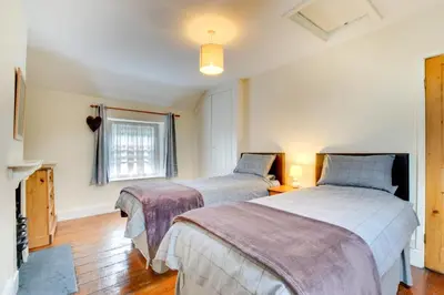 a bedroom with two beds and a window at 2 Bed in Dolgellau oc-wah671 in Dolgellau