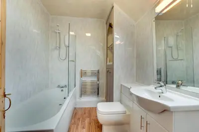 a bathroom with a sink and a toilet and a shower at 2 Bed in Dolgellau oc-wah671 in Dolgellau