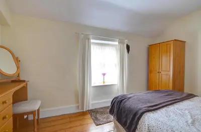 a bedroom with a bed and a window at 2 Bed in Dolgellau oc-wah671 in Dolgellau