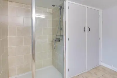 a shower with a glass door in a bathroom at 3 Bed in Builth Wells oc-wal257 in Maesmynis