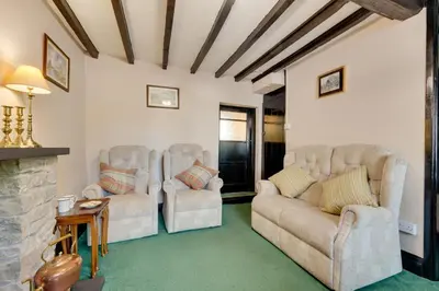a living room with two couches and a fireplace at 2 Bed in Corwen oc-waf161 in Carrog