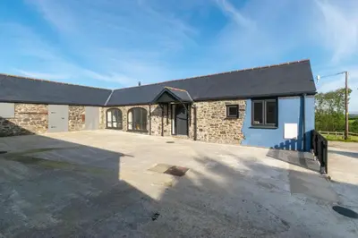 a brick building with a driveway in front of it at 1 Bed in Aberystwyth oc-bow182 in Rhostie