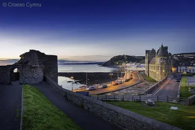 a view of a city with a castle and the ocean at 1 Bed in Aberystwyth oc-bow182 in Rhostie
